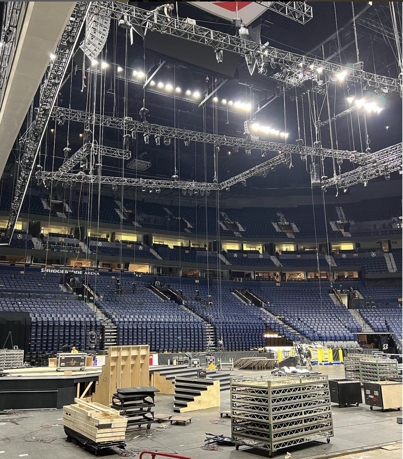Rigging truss and video gear hung over the arena floor during the CMA Awards load-in in Nashville